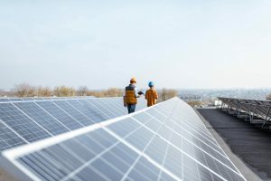 1cfbe889-trc-engineers-walking-solar-panels