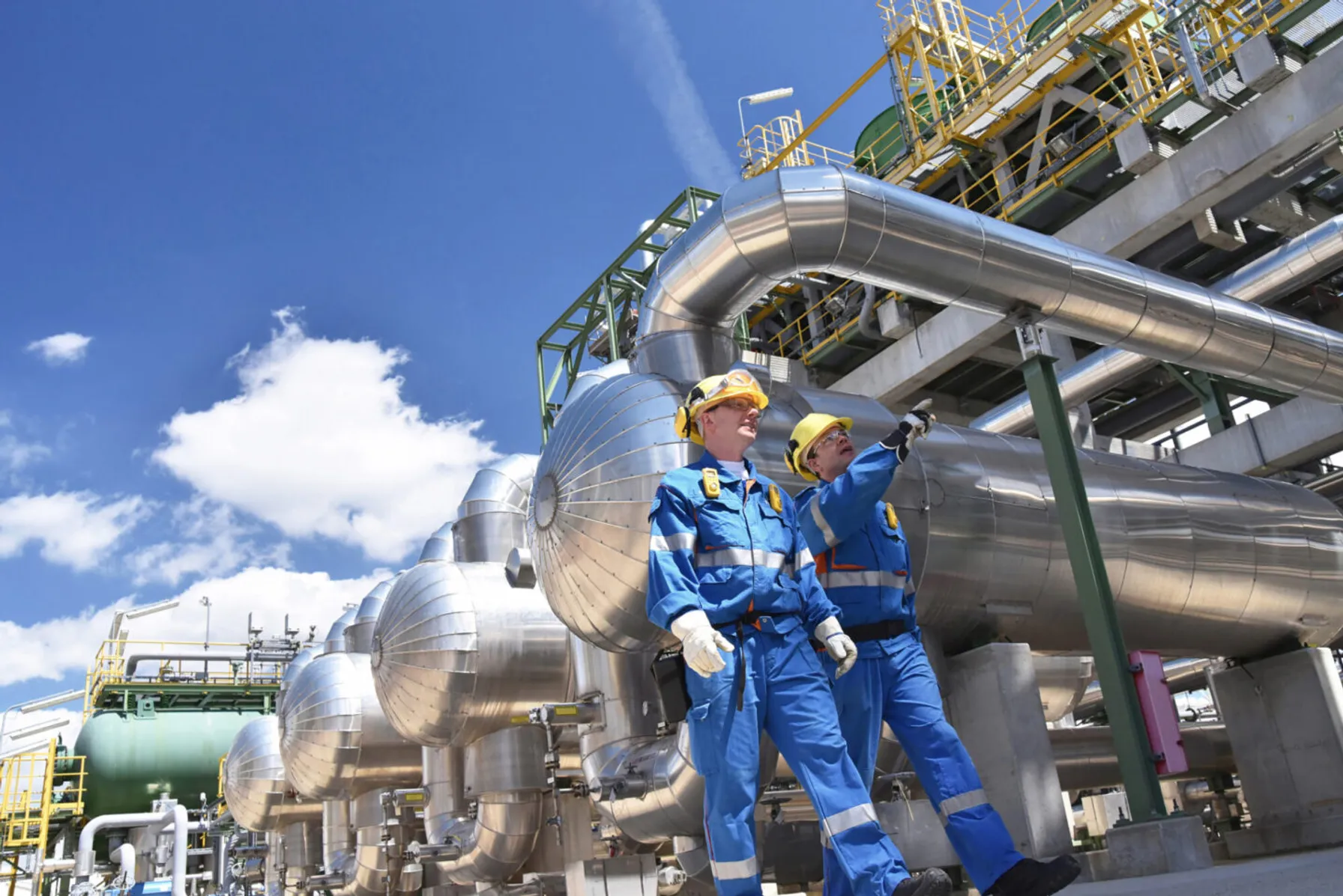 443cb58d-group-of-industrial-workers-in-a-refinery-1039705312-1440x962-1