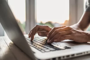 4461ba82-businessman-using-laptop-computer-1137014758