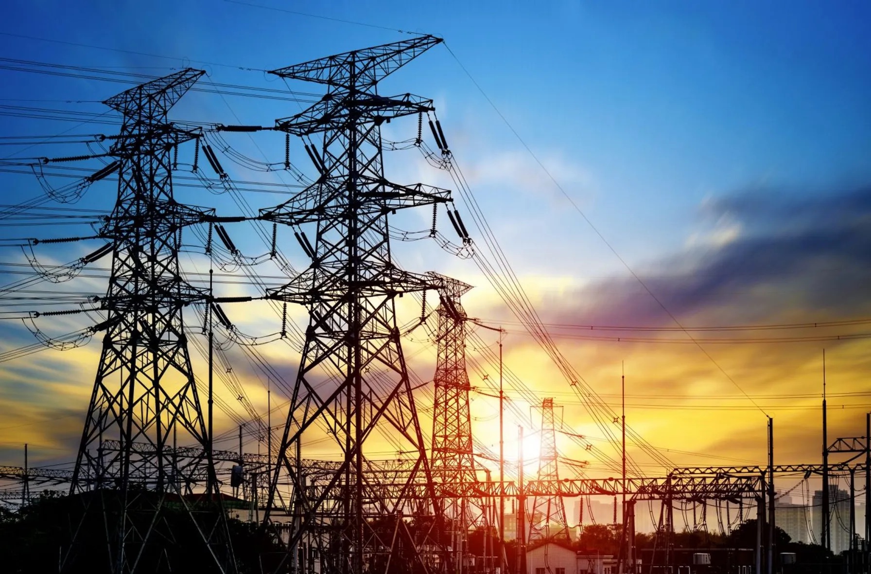 6c6de7b2-high-pressure-wire-tower-at-sunset-at-dusk-950365224-1440x948-1