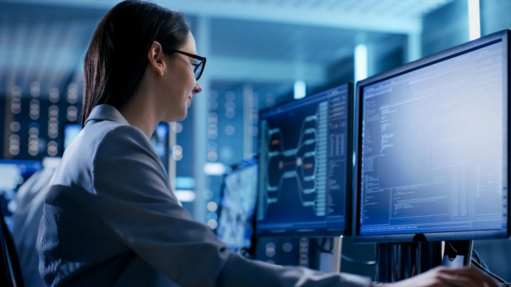 Engineer_working_on_multiple_displays