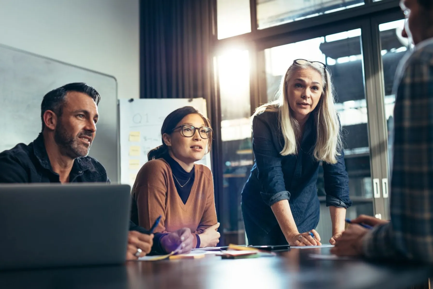 b0e95b7e-business-team-brainstorming-in-conference-room-1015267210-1440x960-1