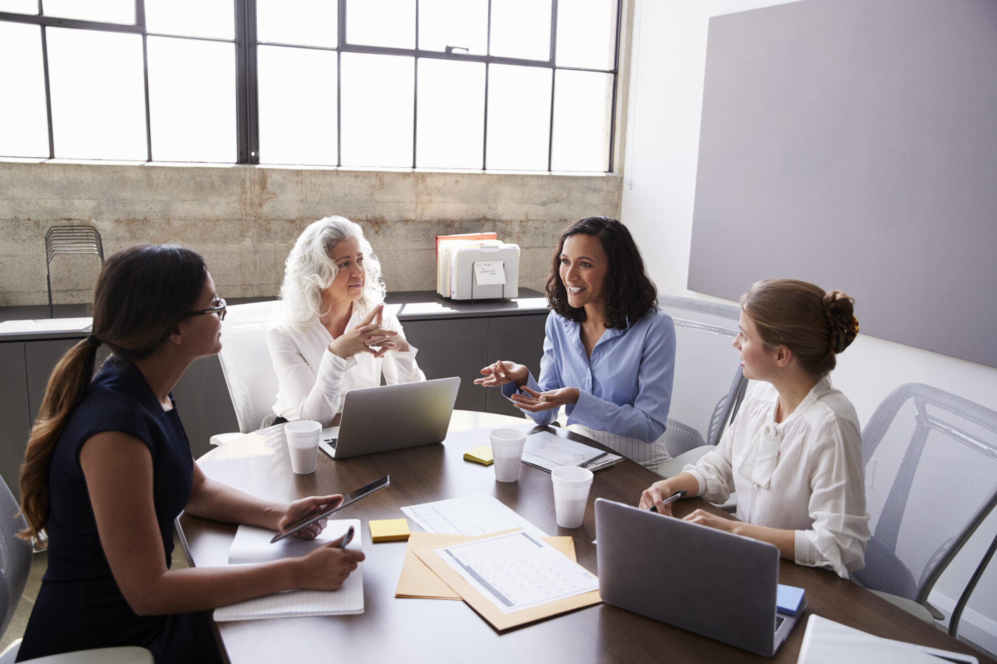 e672e729-four-businesswomen-in-discussion-1010836352