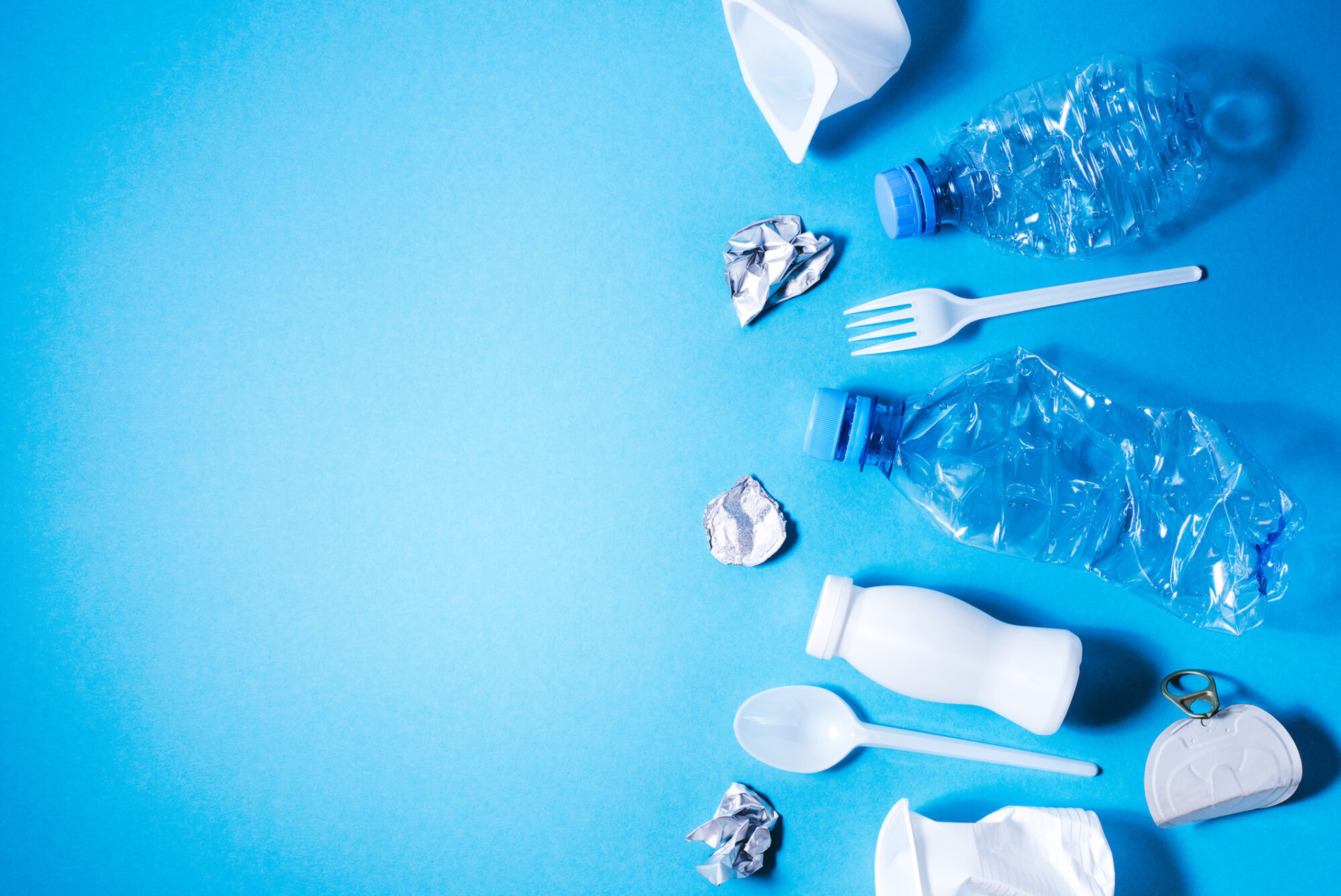 plastic-trash-on-blue-background