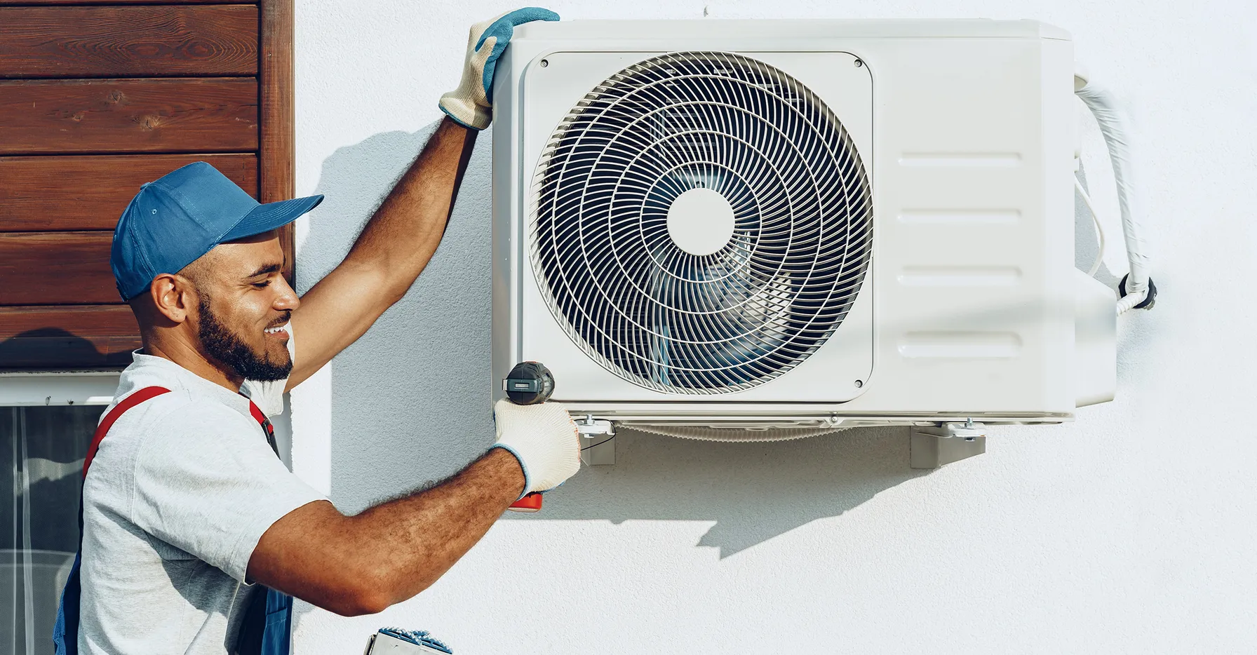 repairman-uniform-installing-outside-unit-air-conditioner-3