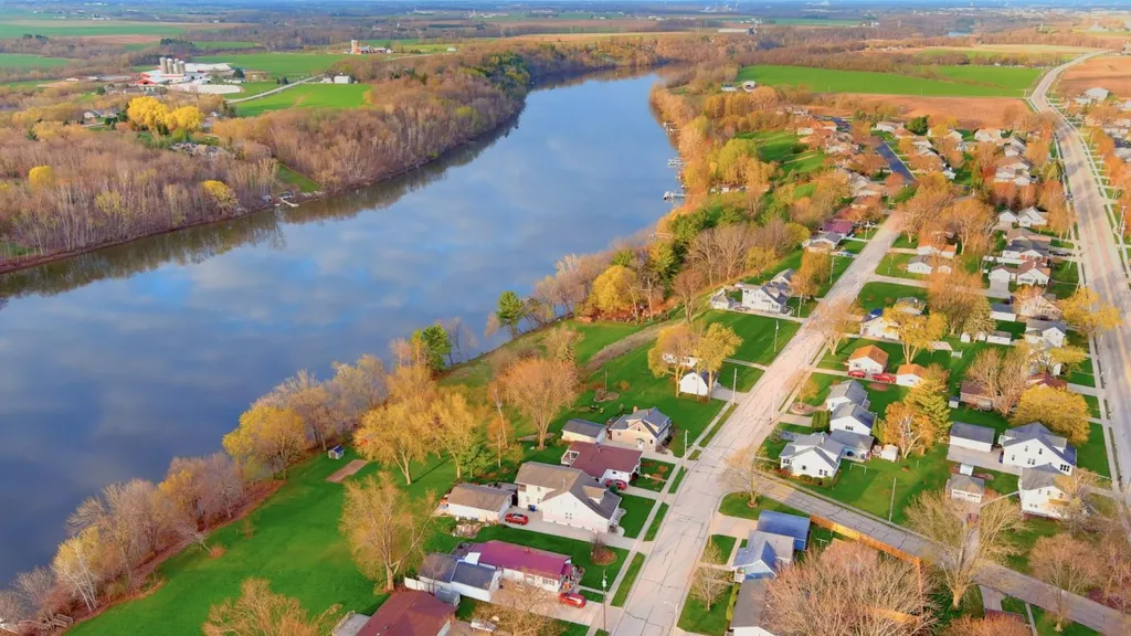 9f1a0f1c-trc-riverside_neighborhood_with_clouds_reflecting_in_water_surface-1440x810-1