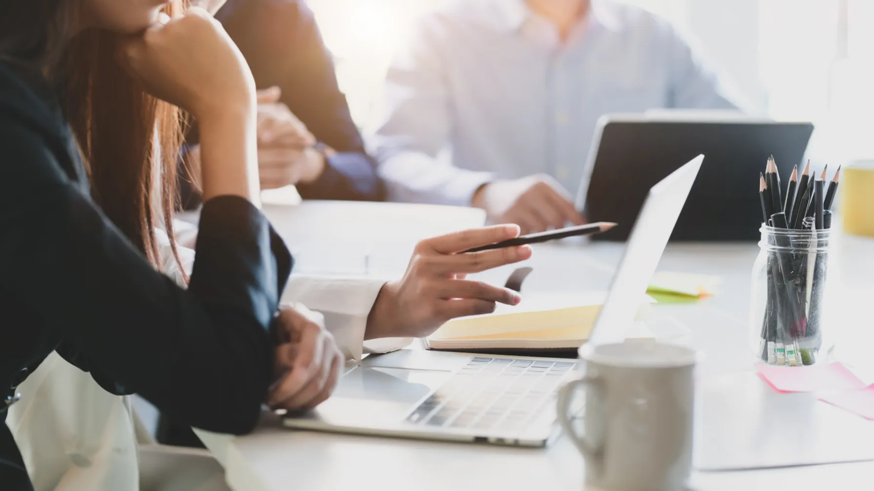 Cropped-shot-of-business-team-analysing-on-their-project-in-comfortable-meeting-room-1199568766