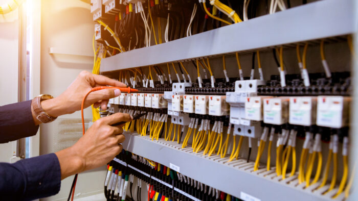 Electrician Measurements With Multimeter Testing Current Ele
