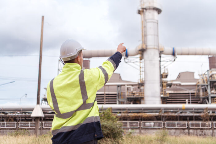 Senior Engineer looking and checking electric power station.