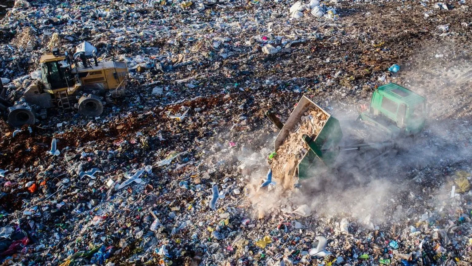 e6c90638-trc-aerial-drone-view-of-truck-unloading-waste-on-landfill