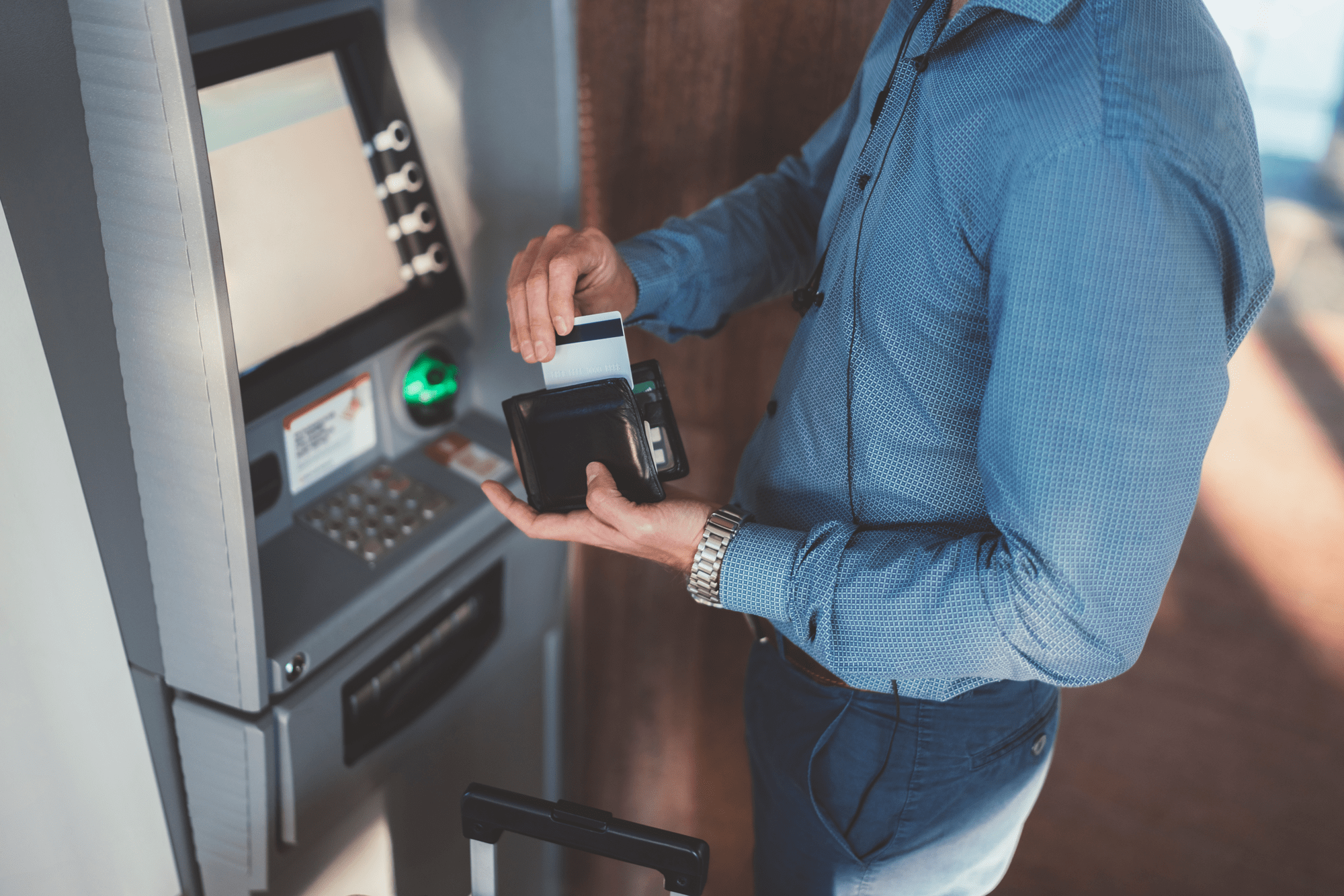 man-at-ATM-min