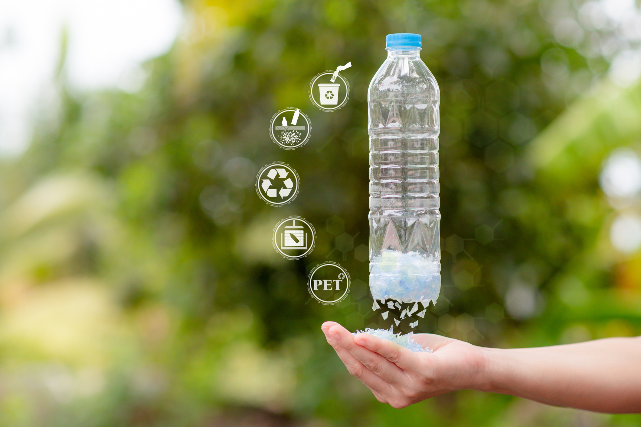 The process of cutting plastic bottles into flakes or small