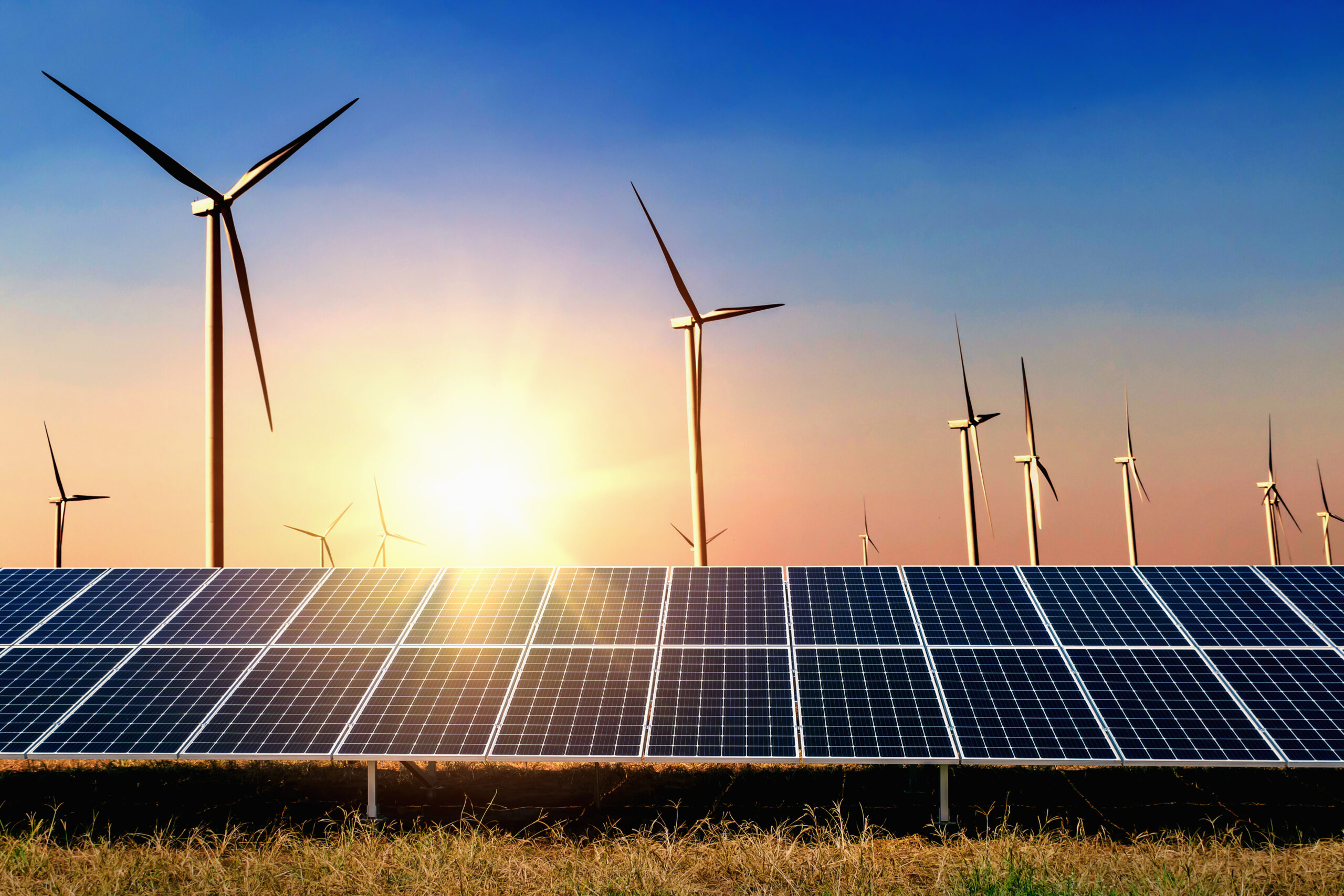 solar-panel-with-turbine-sunset-blue-sky-background-concept-clean-power-energy-scaled