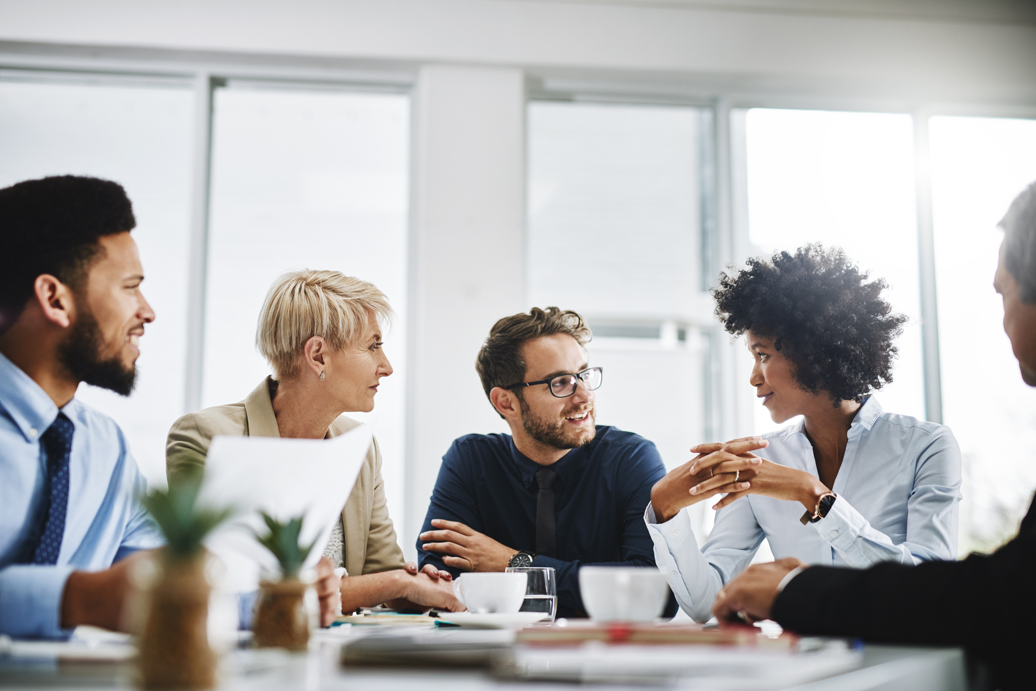 Cropped-shot-of-a-diverse-group-of-businesspeople-1184334685