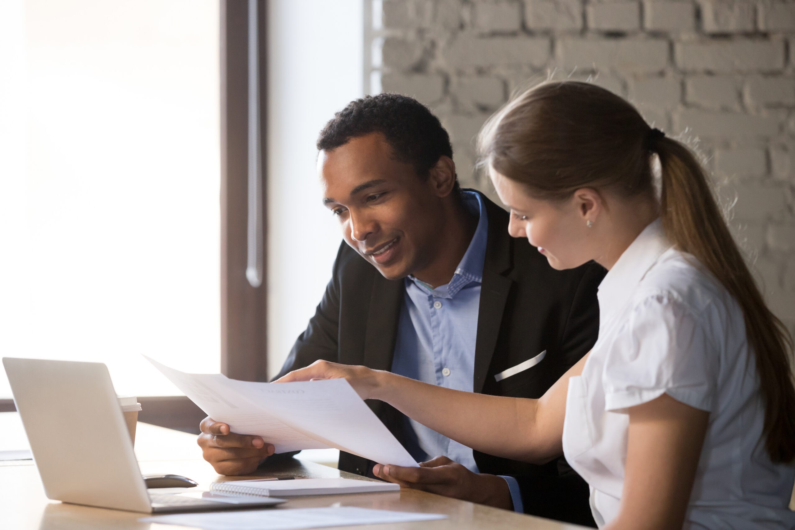 Female-financial-advisor-insurer-consulting-male-1085713900-scaled
