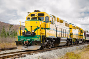 Diesel-locomotive-in-yellow-and-green-180796821-scaled
