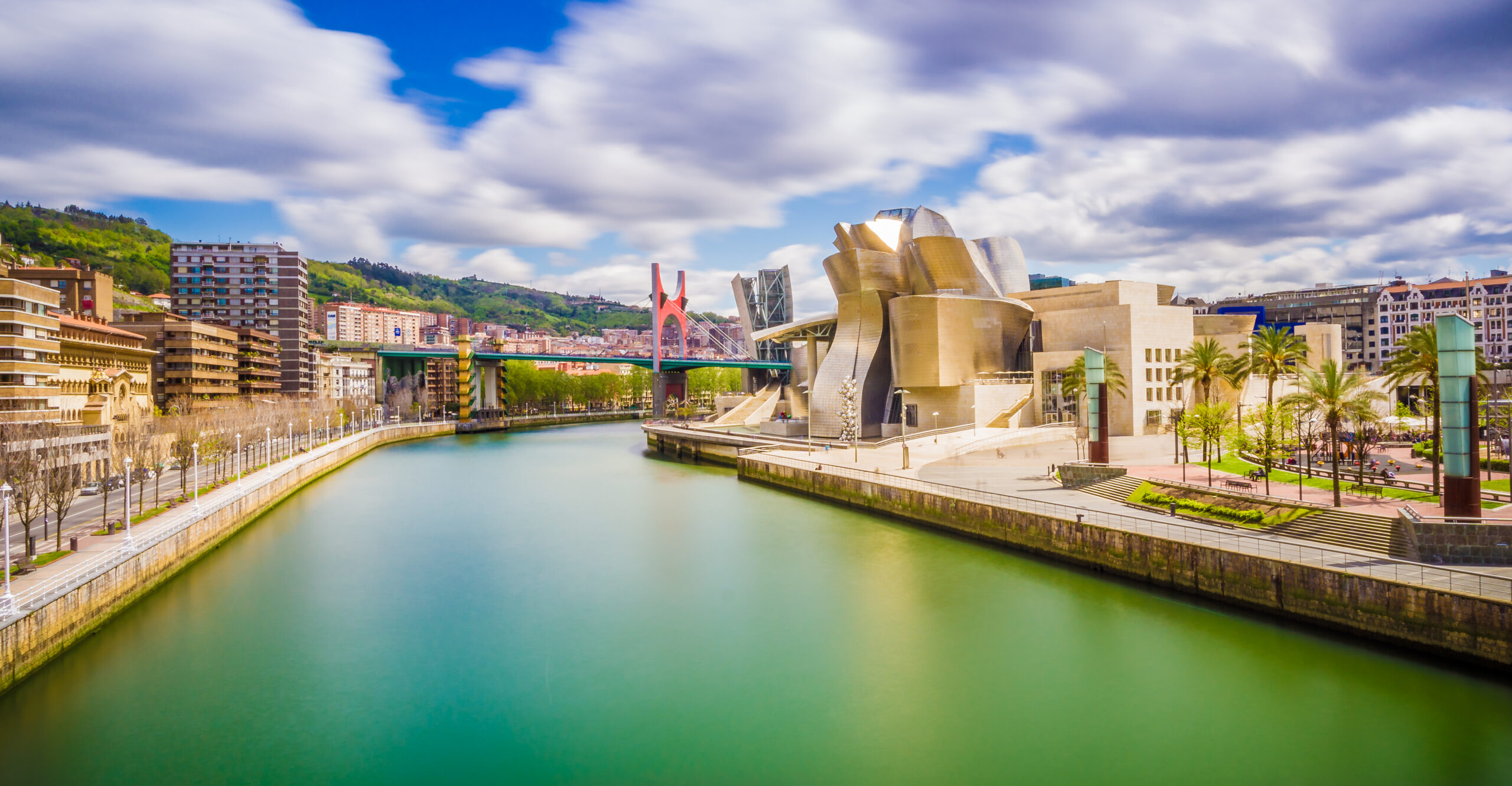 The cityscape of Bilbao, Spain. The Nervion river crosses Bilbao downtown, hosting in its margins the traditional and modern buildings of the city.